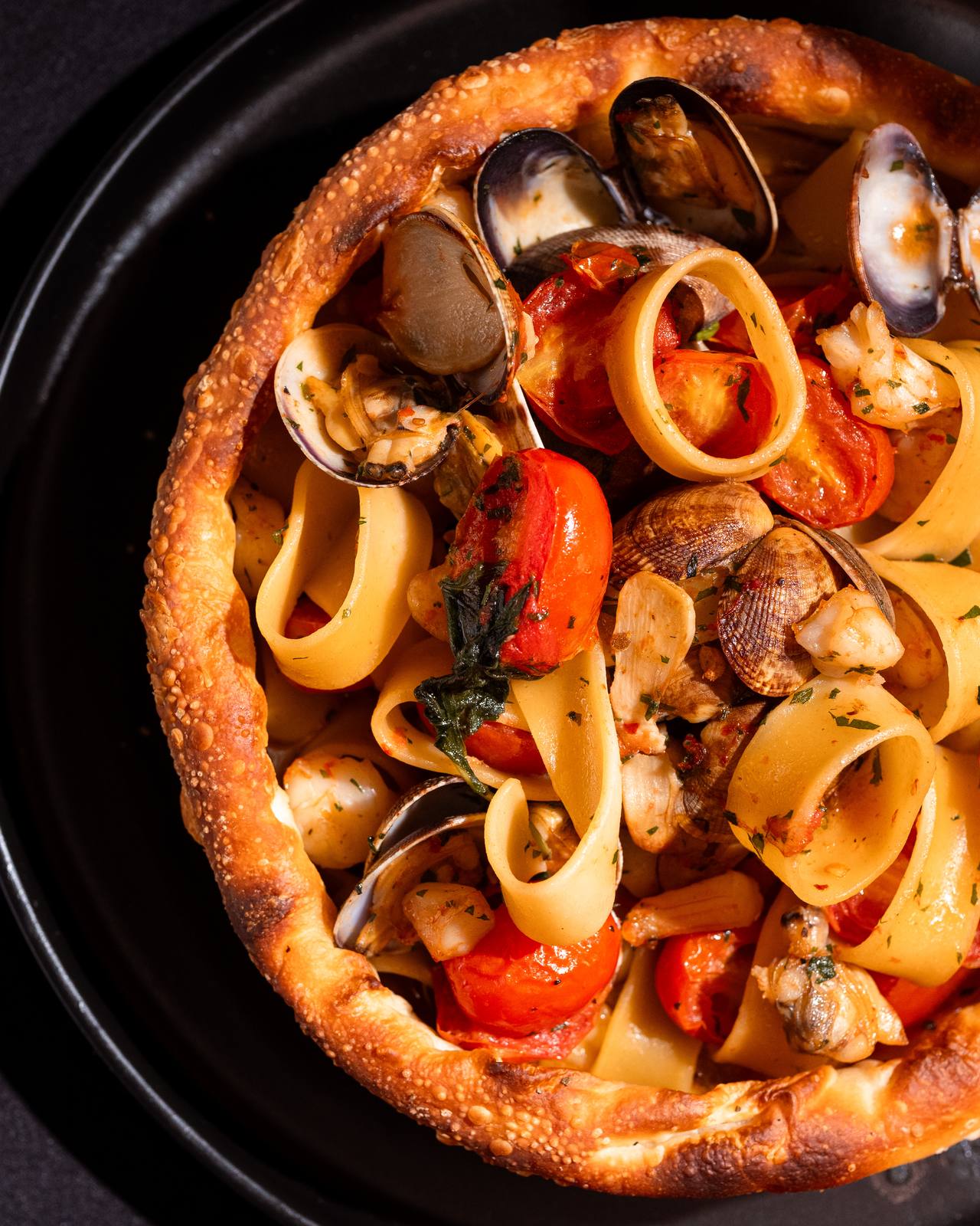 Seafood calamarata in a bread bowl at Baci
