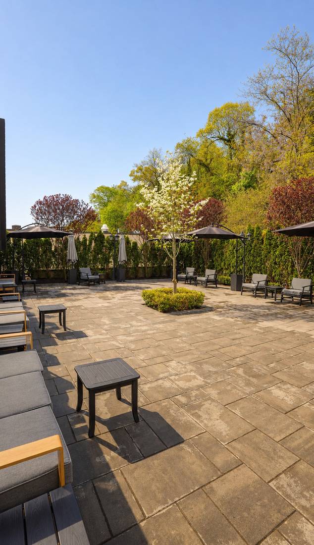 The Rooftop's private outdoor patio with umbrellas and lounge seating